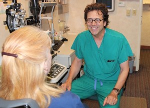 Dr. Stangler explains a procedure to a patient.